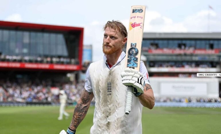 Ben Stokes celebrates after scoring a century in the fourth Test against India at Old Trafford, lifting his bat to the crowd.